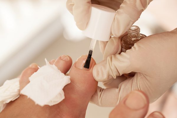 Manicure and nail polish by a nailstylist in a nail salon